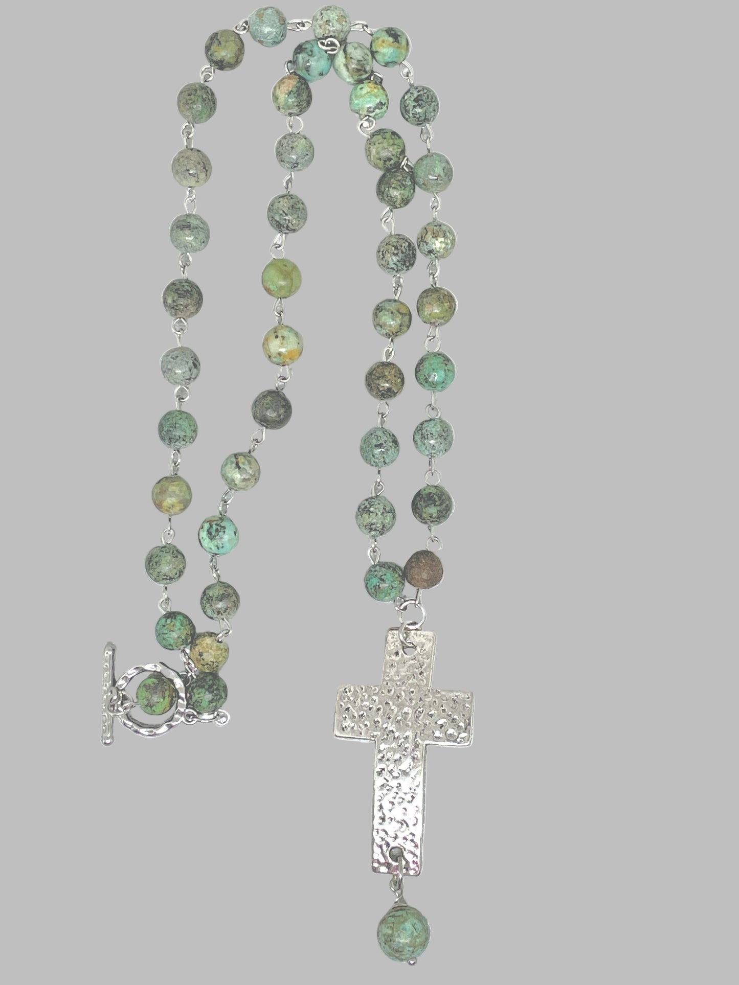 Turquoise Beaded Necklace accented with a Silver Hammered Cross