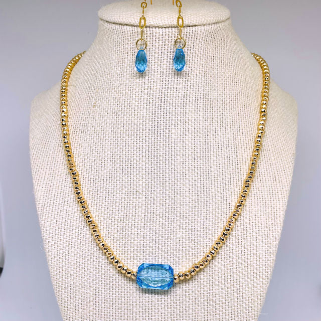 Gold Faceted Hematite Necklace with Blue Rectangle Crystal and Drop Earrings with Blue Crystal