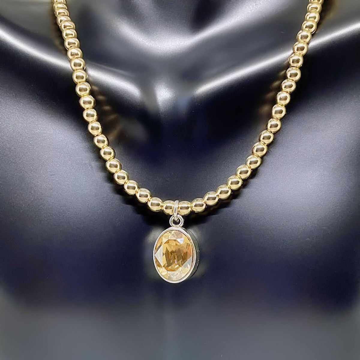 Gold Hematite Necklace accented with Champagne Crystal Stone