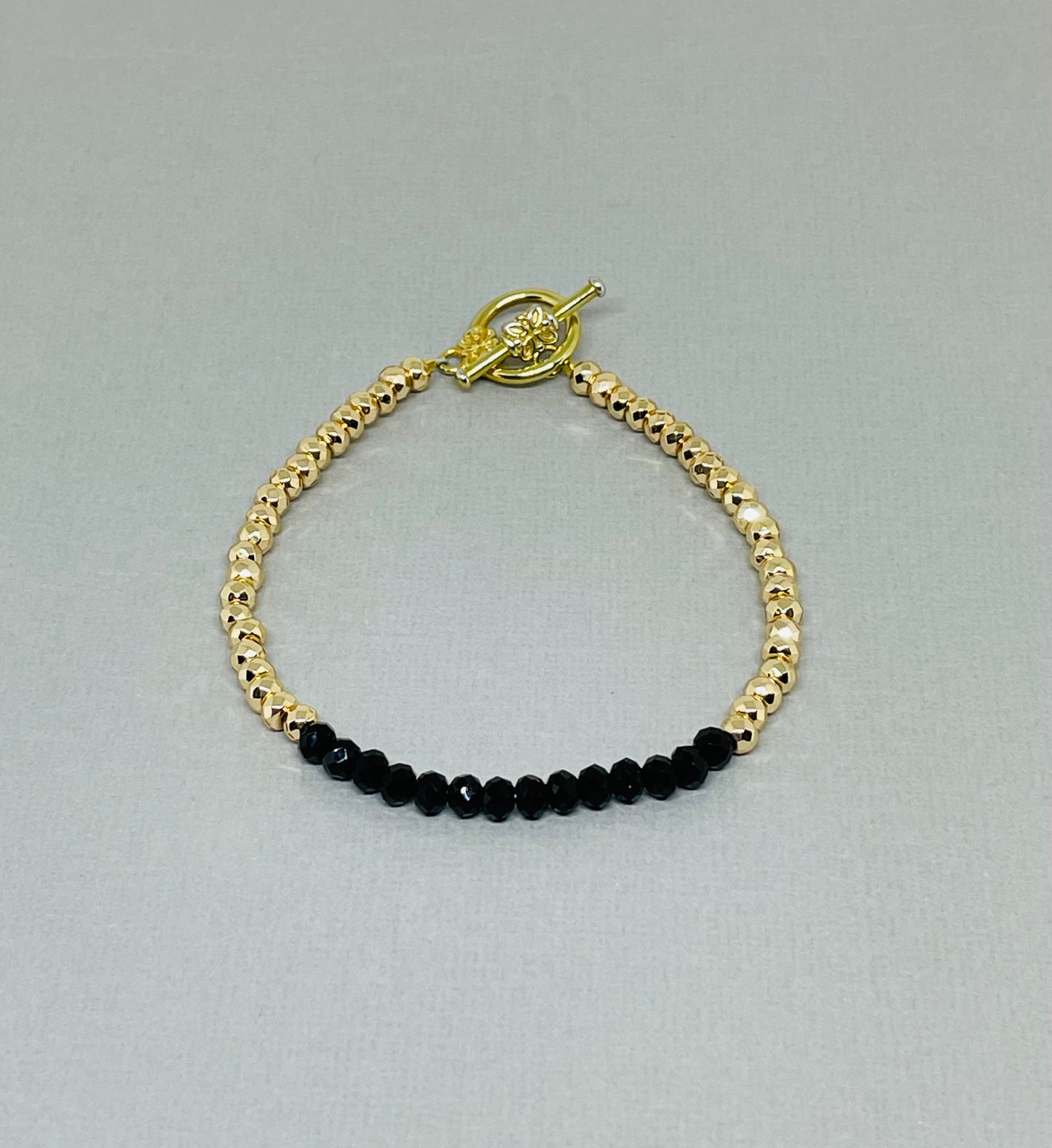 Gold Faceted Hematite Bracelet with Faceted Black Onyx Beads