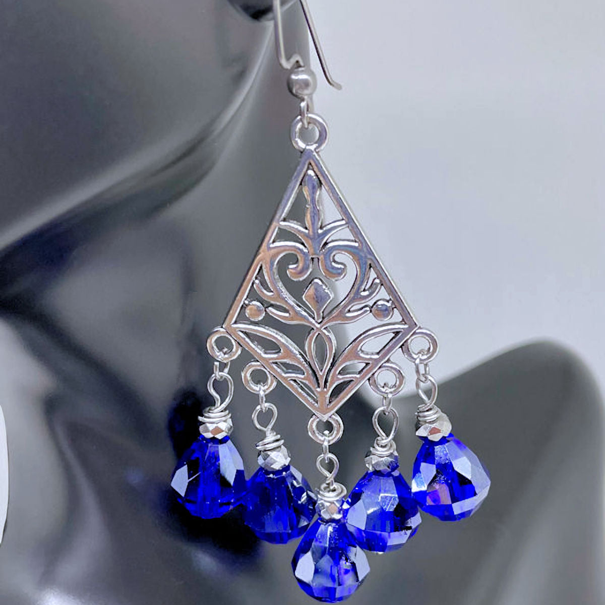 Filigree dangling earrings with Faceted Royal Blue Teardrop crystals