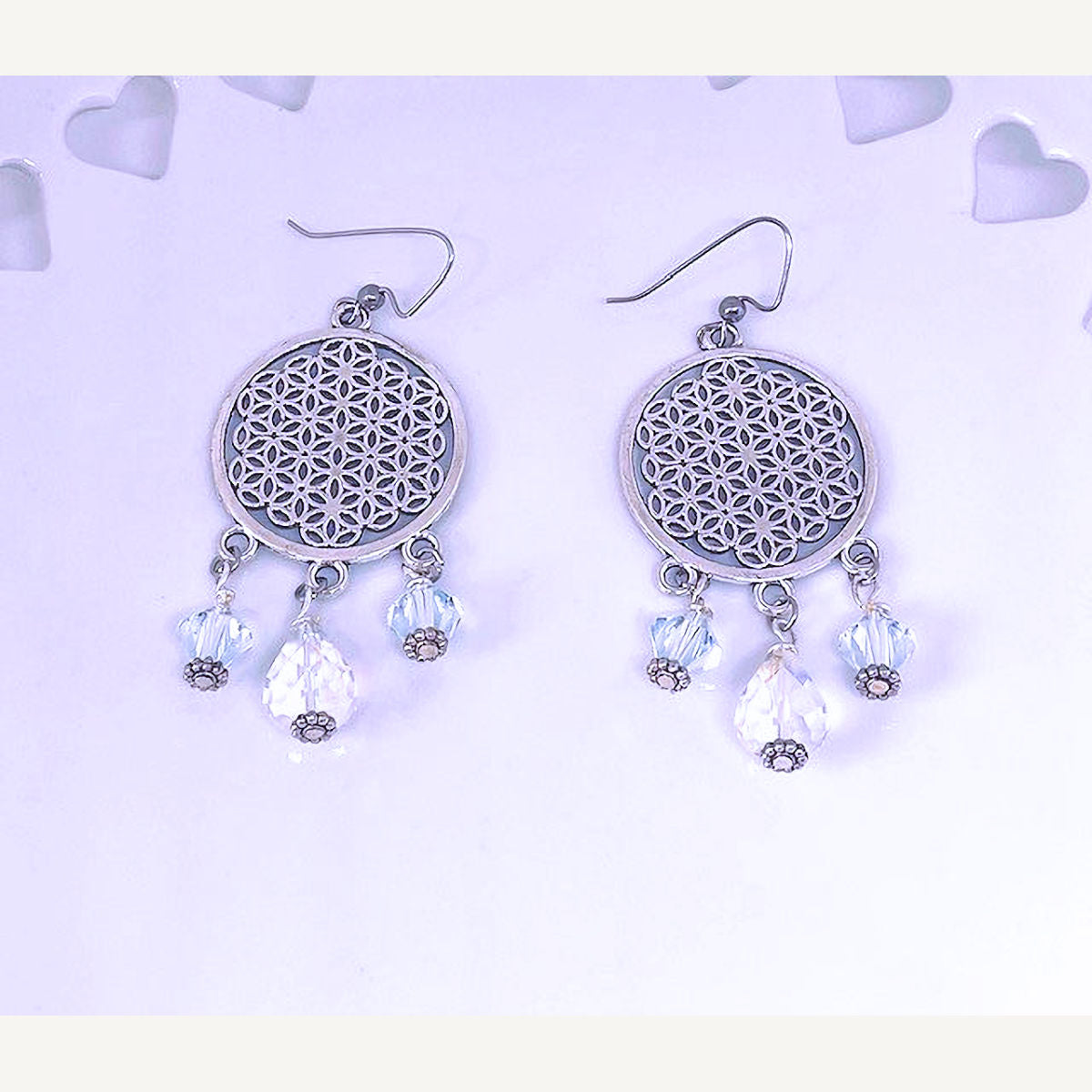 Round Silver Plated Filigree Earrings accented with Electroplated Clear Crystal Beads