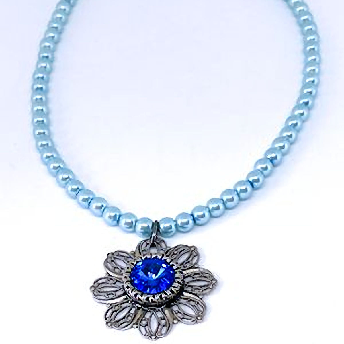 Pastel Blue Pearl Necklace with Antique Silver Filigree Pendant and Dark Blue Crystal Accent