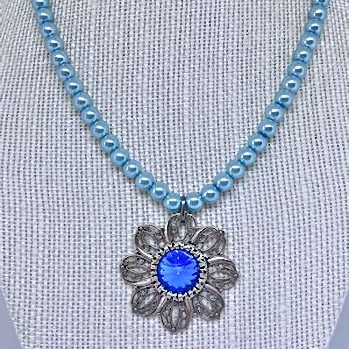 Pastel Blue Pearl Necklace with Antique Silver Filigree Pendant and Dark Blue Crystal Accent