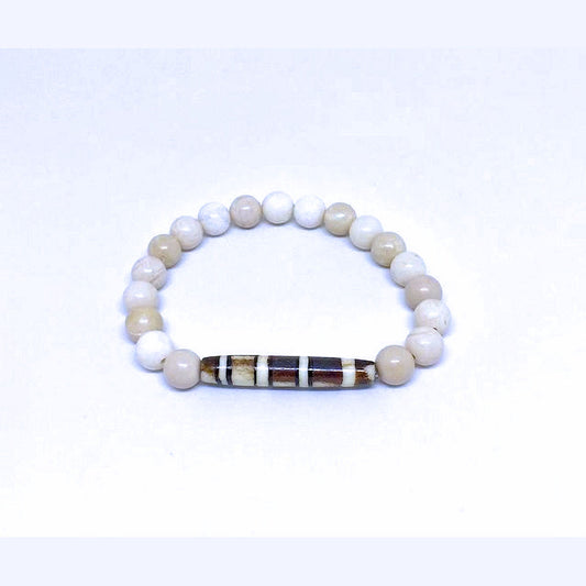 Antiqued Bone Stretch Bracelet Accented with a Carved Tribal Bead