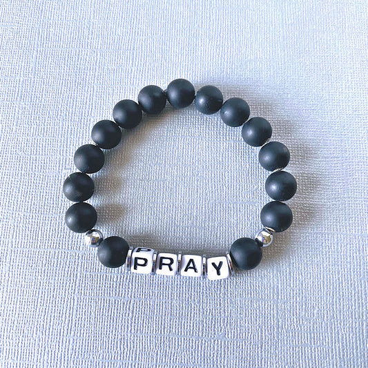 Spiritual Resonance: Matte Black Onyx Stretch Bracelet with 'PRAY' Inspiration